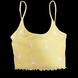 small yellow cropped tank with daisies